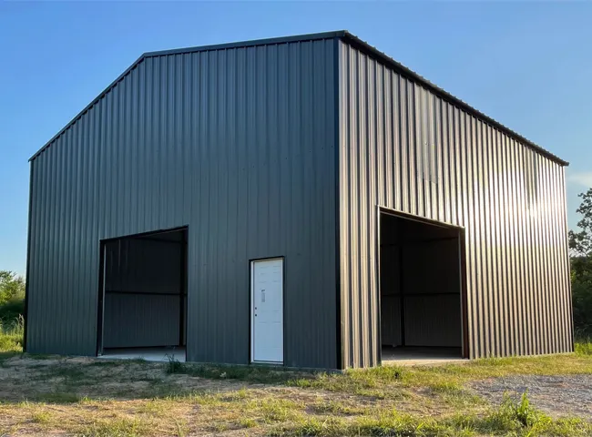 Metal farm building with two large doors