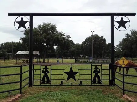 elaborate metal entrance to ranch